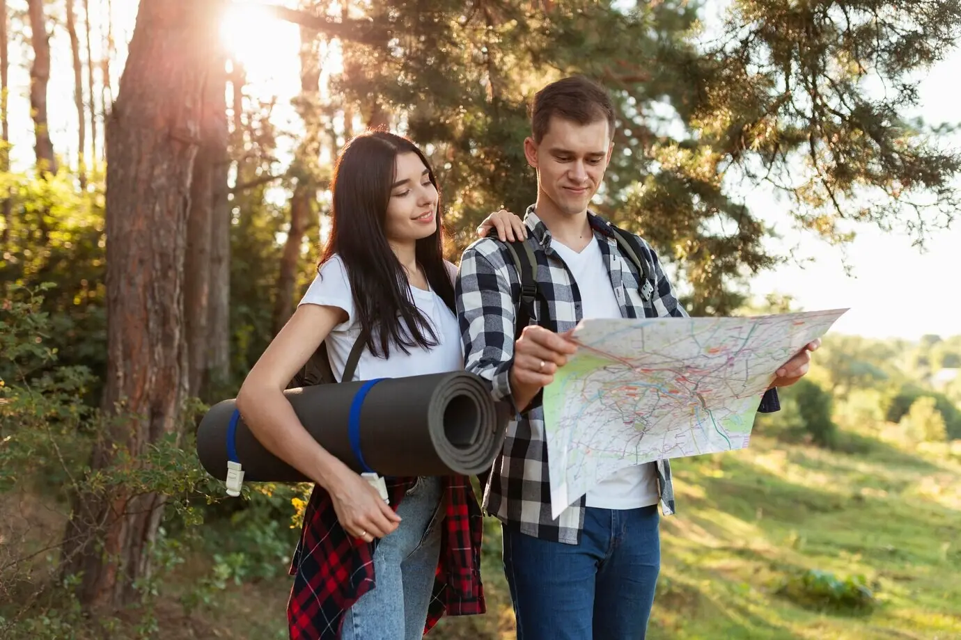 Relaxed young couple checking a local map.